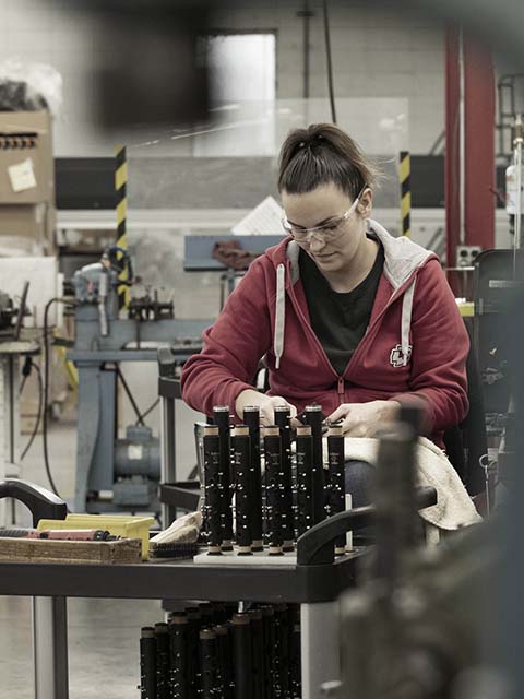 woman building clarinets